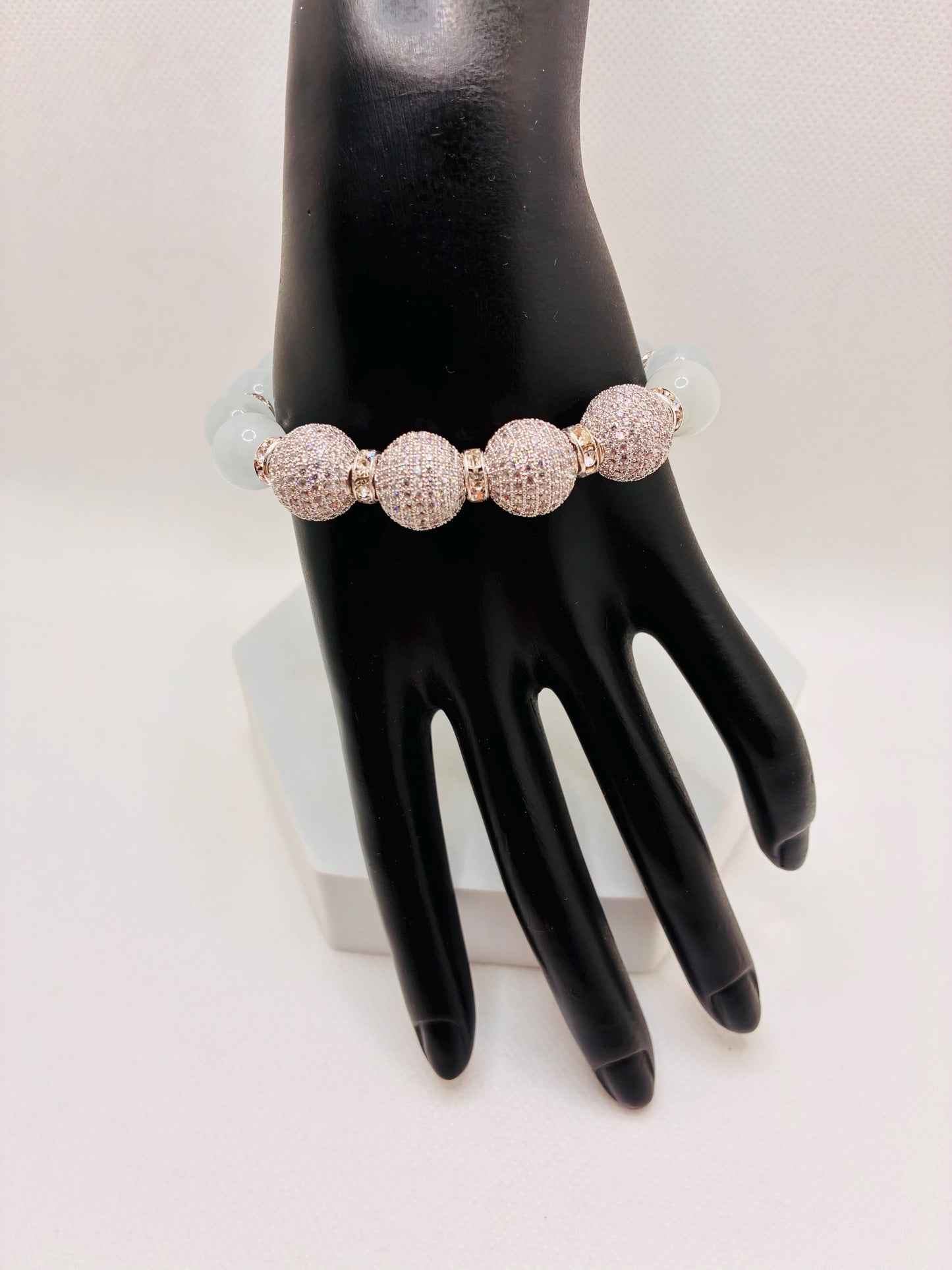 White Cats Eye Beaded Bracelet with Silver Cubic Zirconia Beads: Silverplated rhinestone rondelles