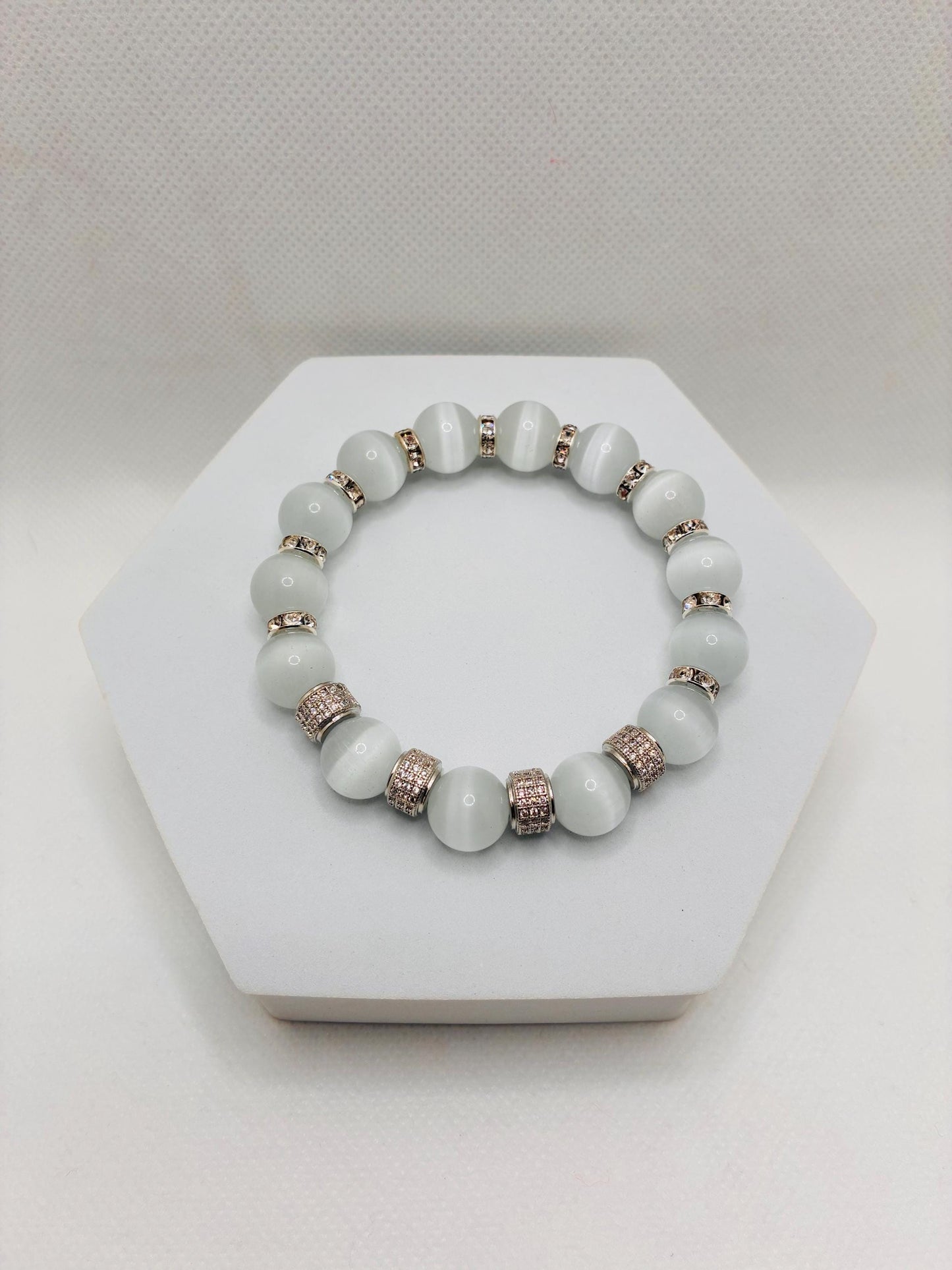 White Cats Eye Bracelet with Silver Zirconia Barrel Beads: Silverplated rhinestone rondelles