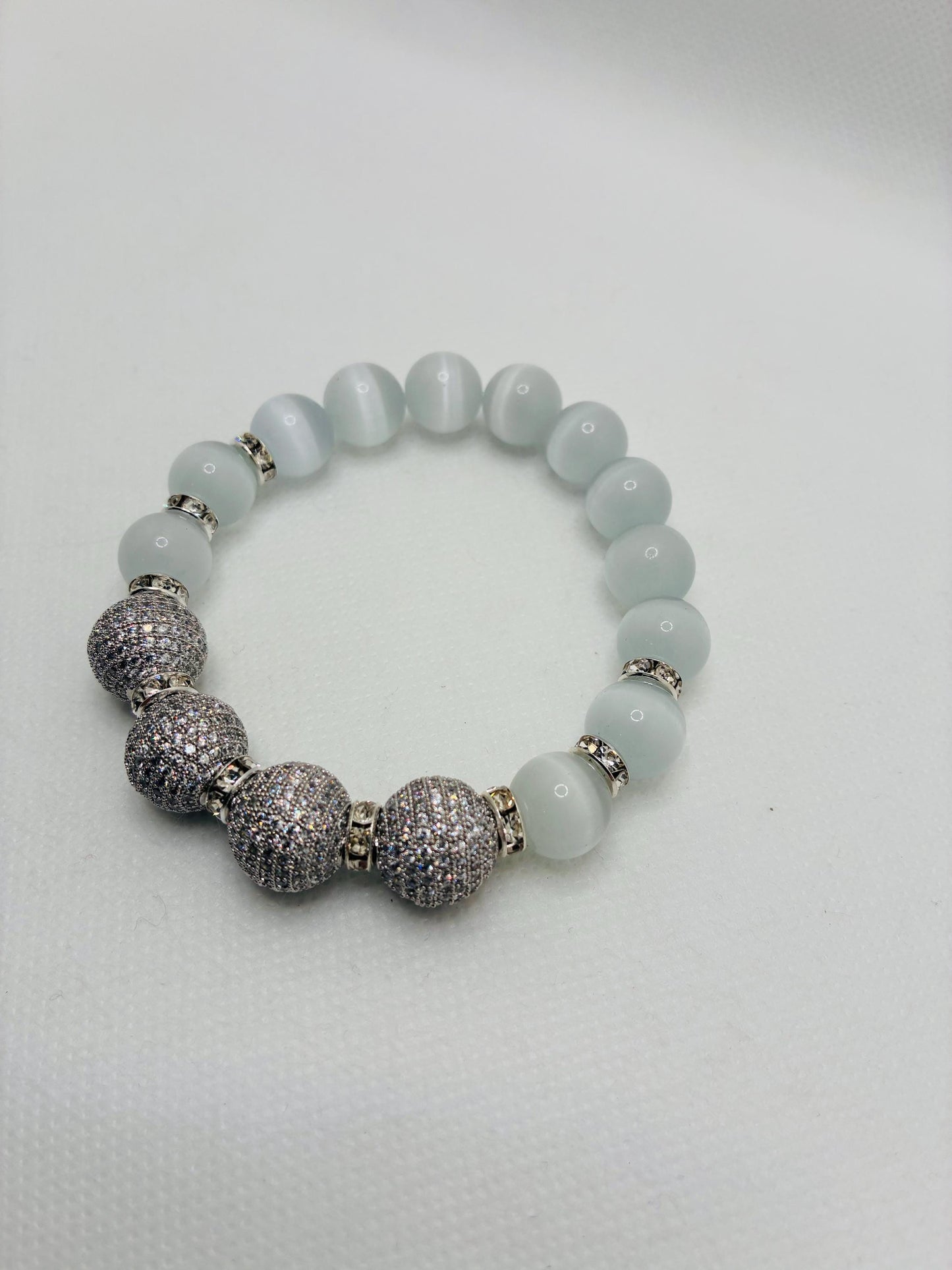 White Cats Eye Beaded Bracelet with Silver Cubic Zirconia Beads: Silverplated rhinestone rondelles