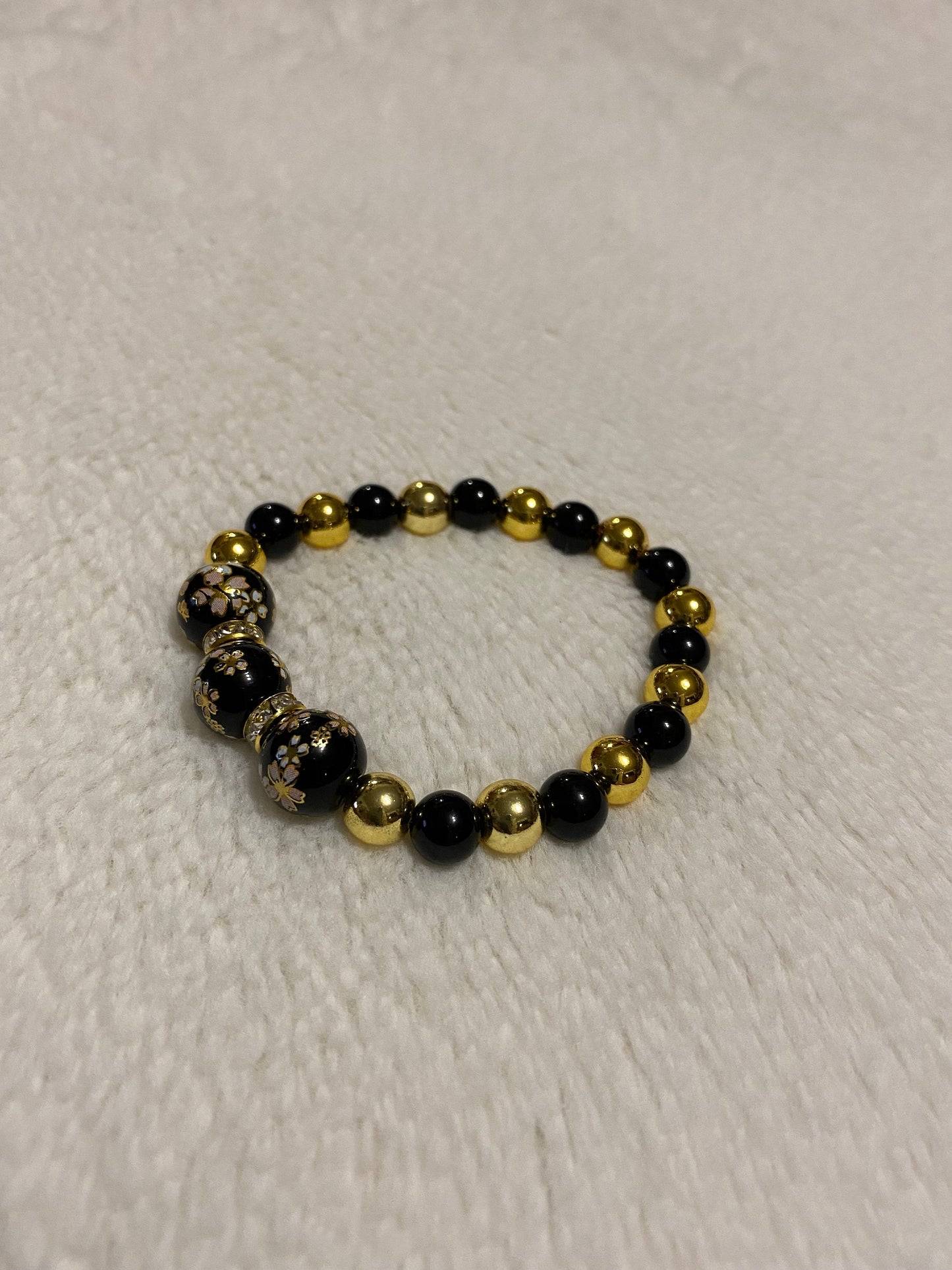 Handmade Floral Painted Glass Bead Bracelet: Onyx & 18k Gold Hematite