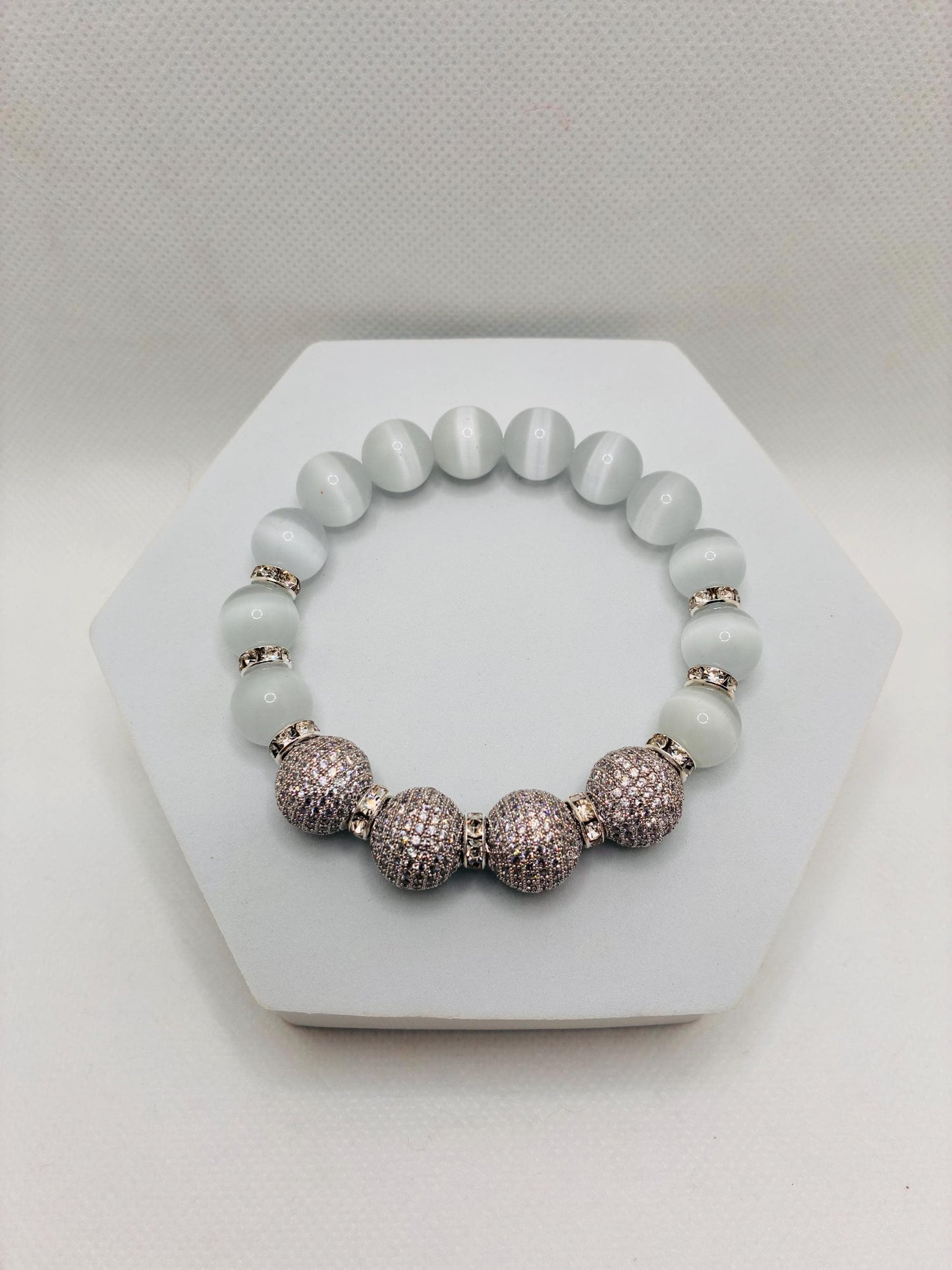 White Cats Eye Beaded Bracelet with Silver Cubic Zirconia Beads: Silverplated rhinestone rondelles