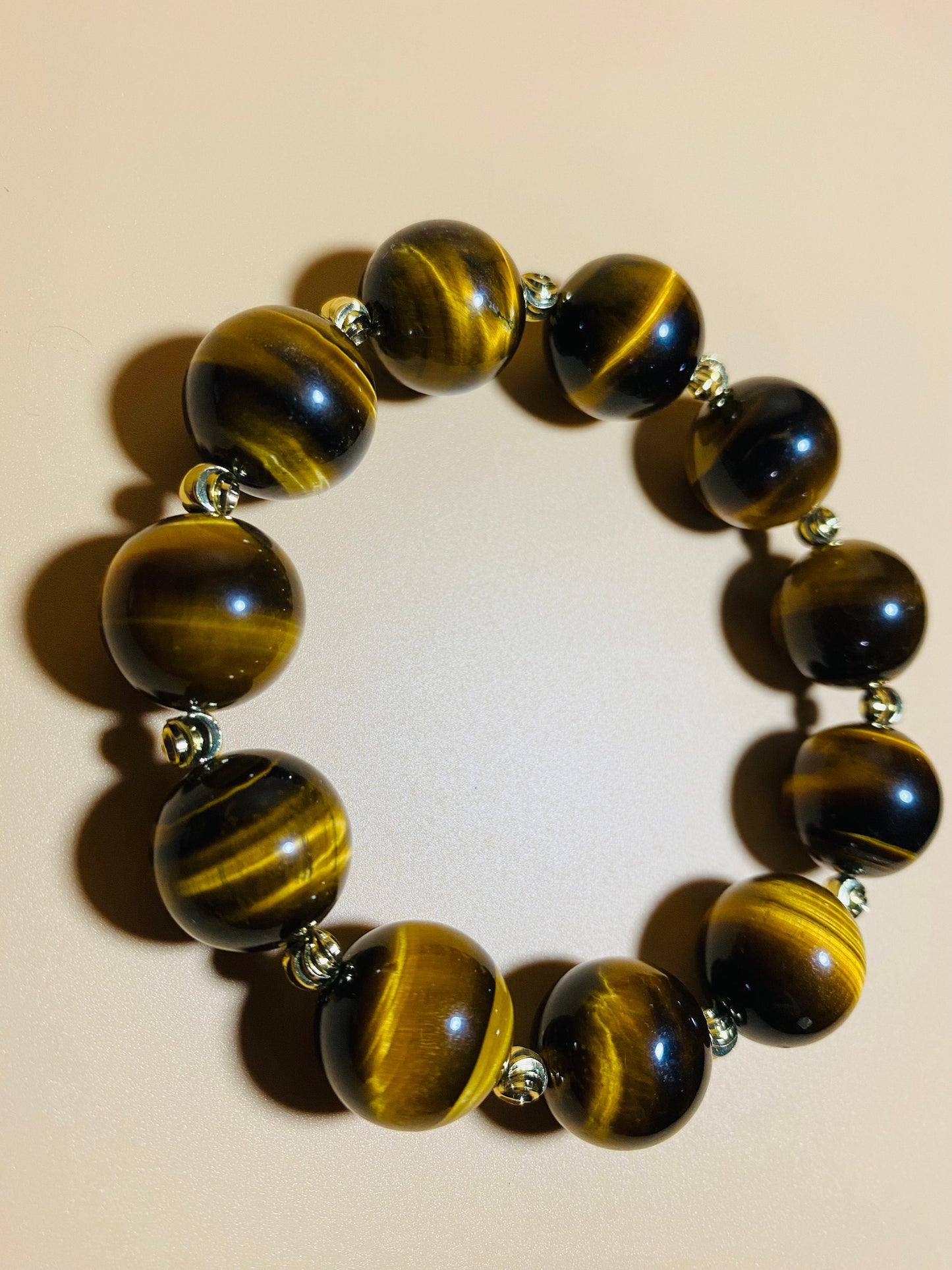 Tigers Eye Gemstone Bracelet: 16mm Beads with Gold Spacers
