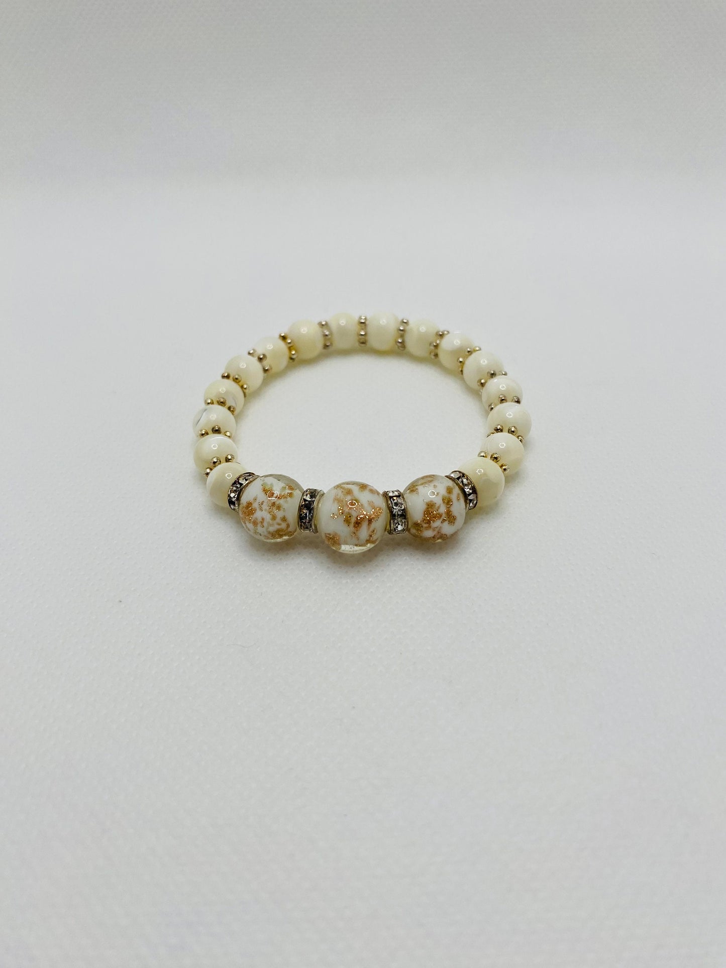 Handmade Mother of Pearl Bracelet: Lampwork Glass Beads, Silver Snowflakes