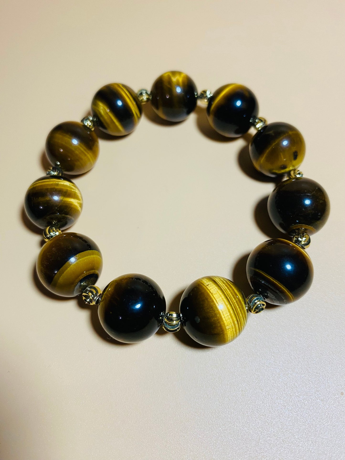 Tigers Eye Gemstone Bracelet: 16mm Beads with Gold Spacers
