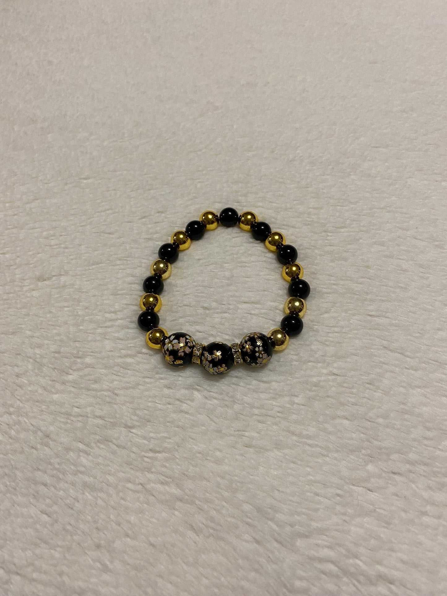 Handmade Floral Painted Glass Bead Bracelet: Onyx & 18k Gold Hematite