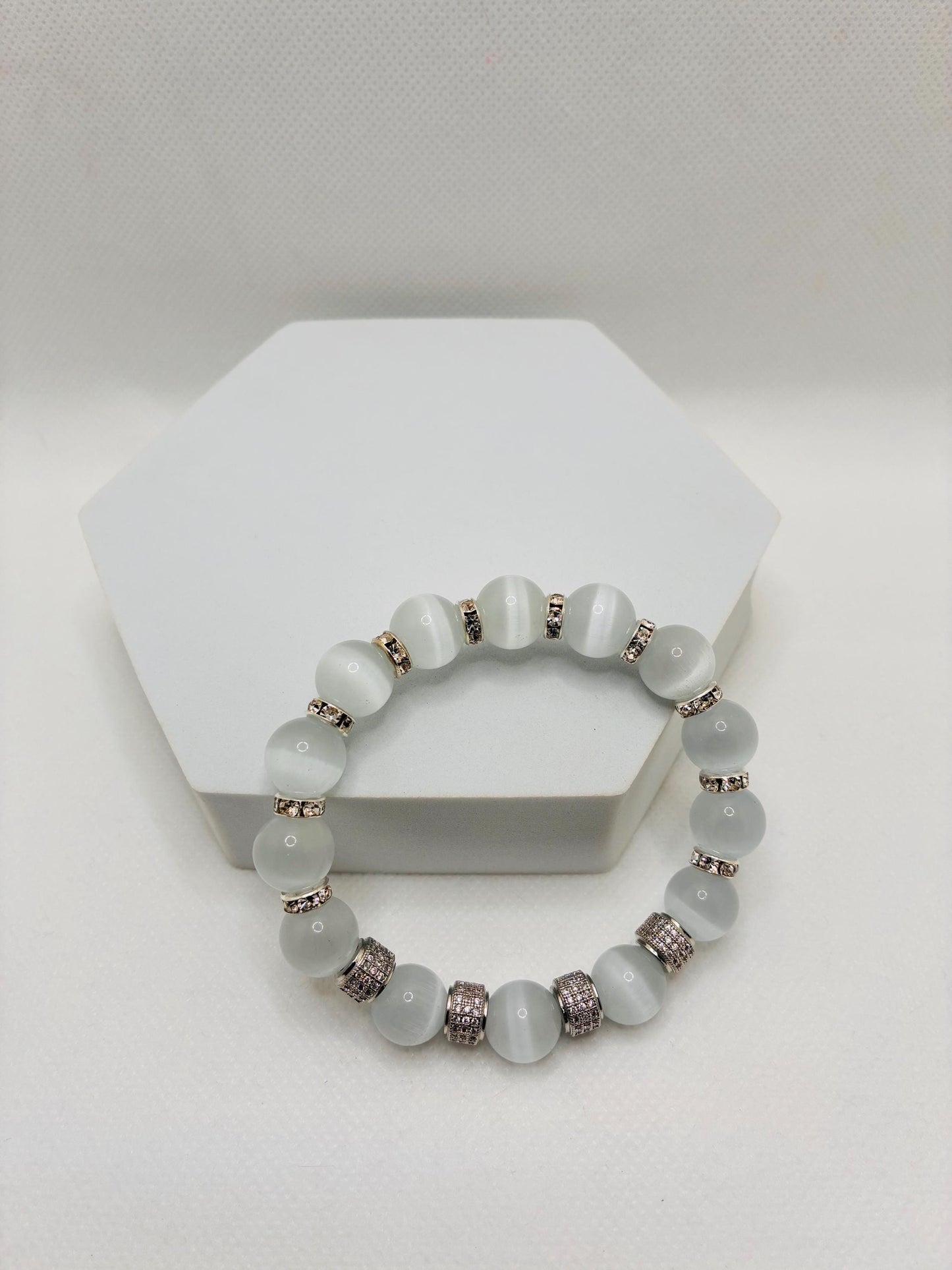 White Cats Eye Bracelet with Silver Zirconia Barrel Beads: Silverplated rhinestone rondelles