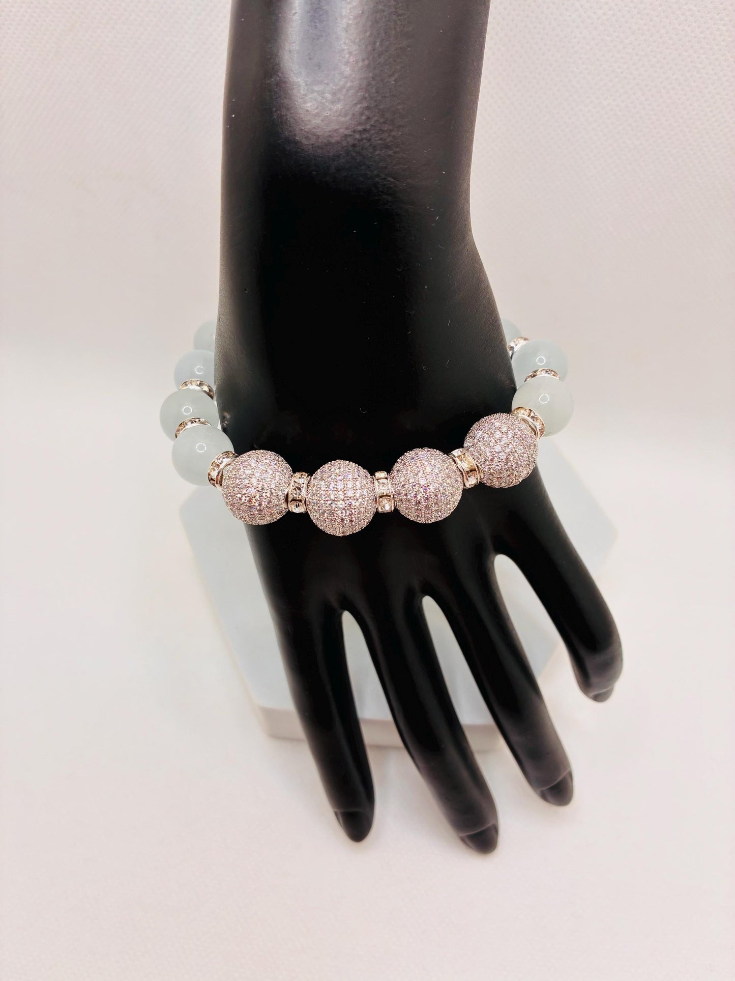 White Cats Eye Beaded Bracelet with Silver Cubic Zirconia Beads: Silverplated rhinestone rondelles