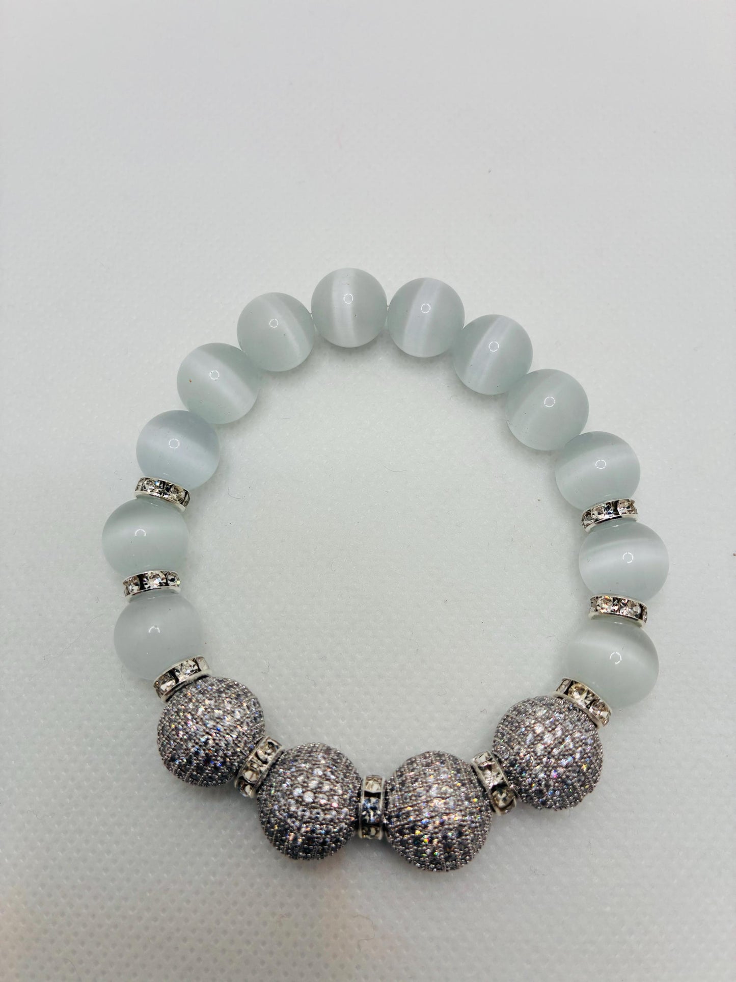 White Cats Eye Beaded Bracelet with Silver Cubic Zirconia Beads: Silverplated rhinestone rondelles