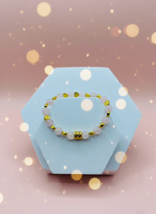 Background for Rose Quartz Bracelet with 18K Gold Heart & Taurus Zodiac Charm