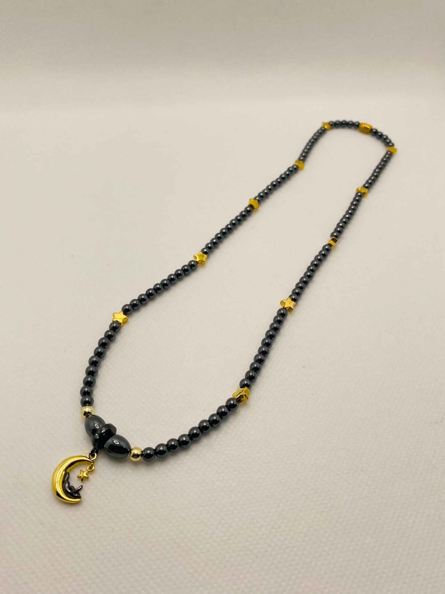 Celestial Hematite Necklace: Gold Star, Moon & Cat Charm