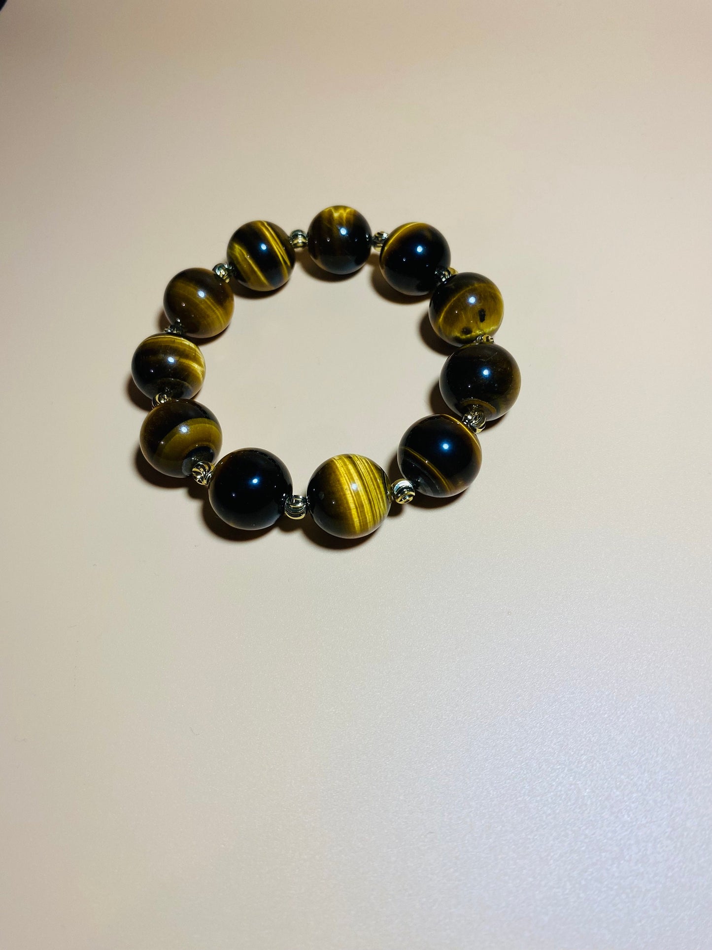 Tigers Eye Gemstone Bracelet: 16mm Beads with Gold Spacers