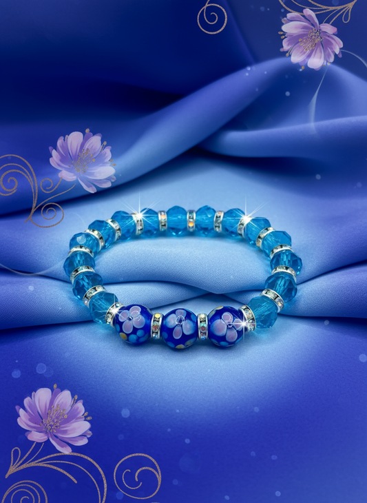 Enhanced background for Blue Topaz Crystal Bracelet with Lampwork Floral Glass Beads