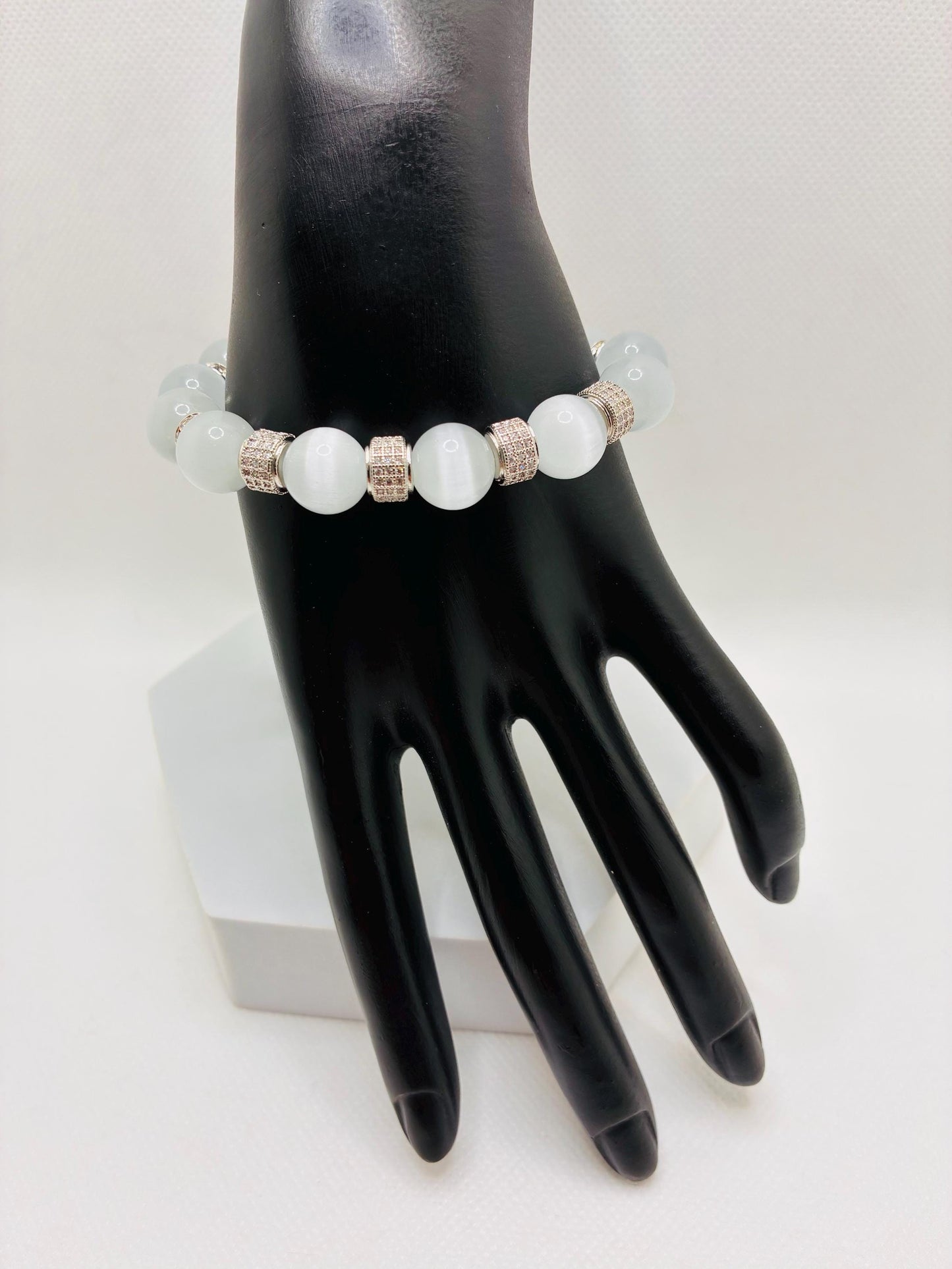 White Cats Eye Bracelet with Silver Zirconia Barrel Beads: Silverplated rhinestone rondelles