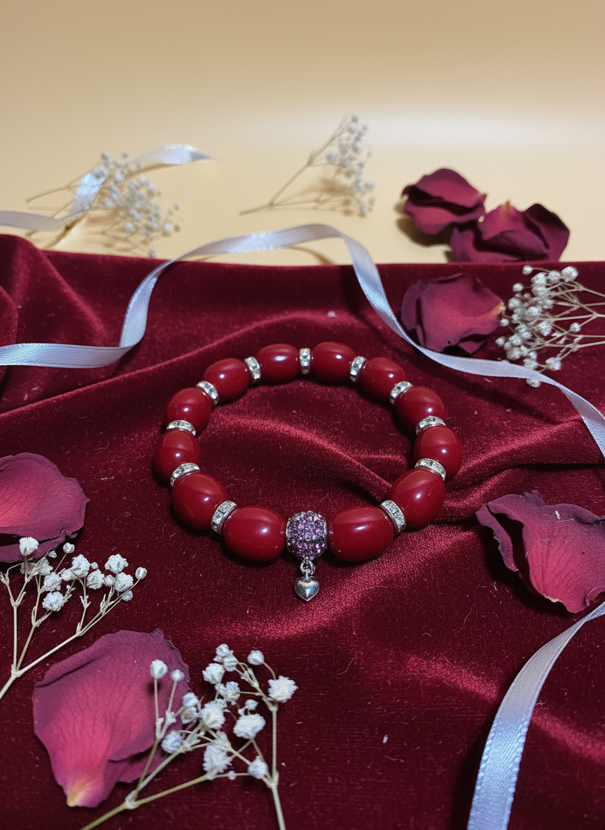 Red Jade Bracelet with Heart Charm and Silver Details Background
